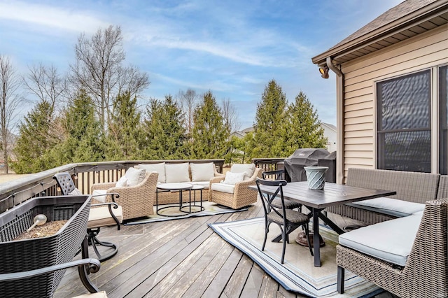 deck featuring outdoor dining area, grilling area, and outdoor lounge area