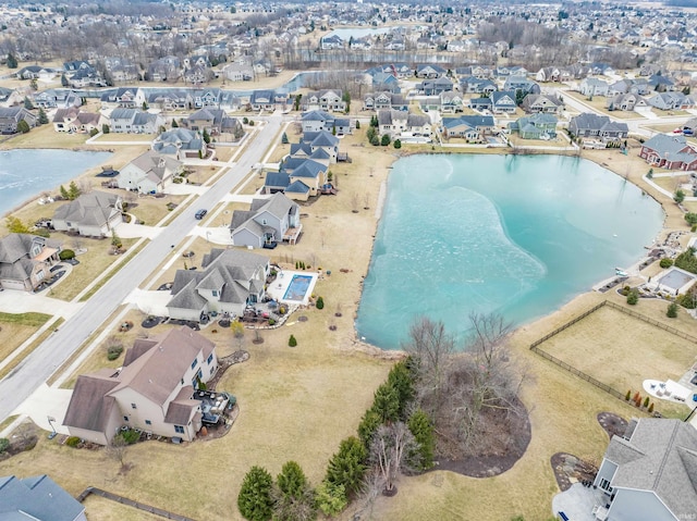 birds eye view of property featuring a residential view and a water view