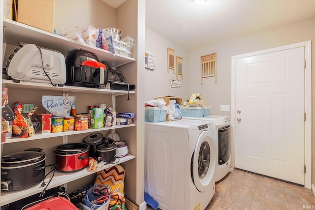 washroom featuring laundry area and washer and clothes dryer