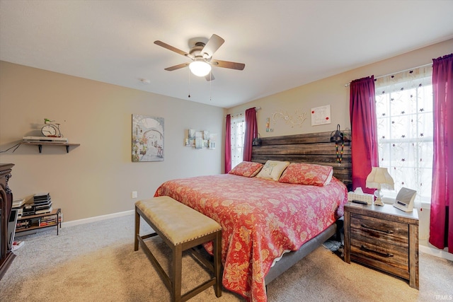 bedroom with carpet, baseboards, and ceiling fan