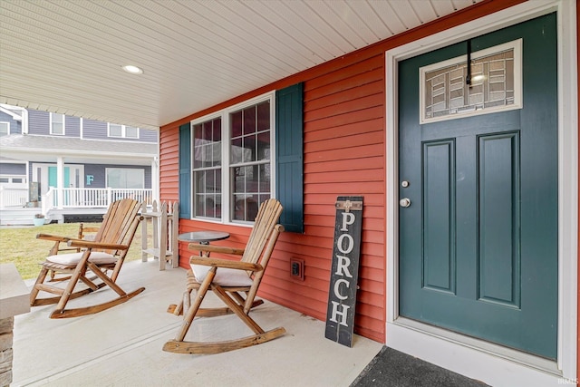 property entrance featuring a porch