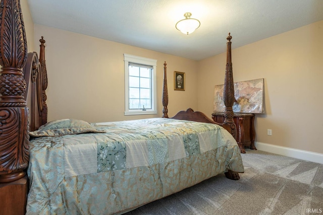 bedroom featuring carpet and baseboards