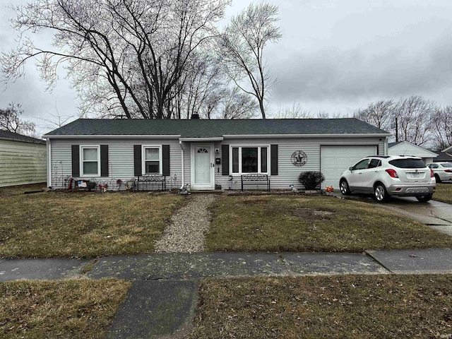 ranch-style home with concrete driveway, an attached garage, and a front yard