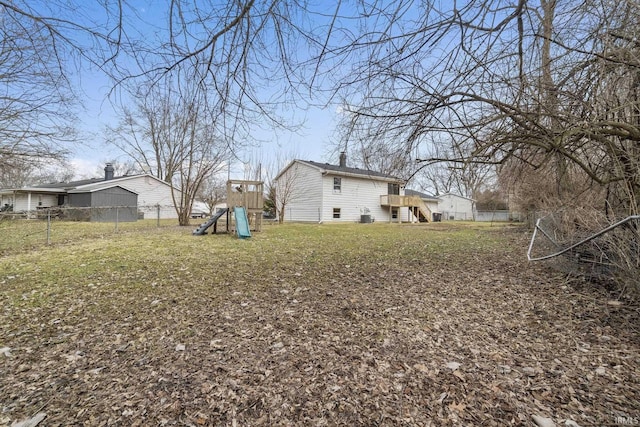 view of yard with a playground and fence