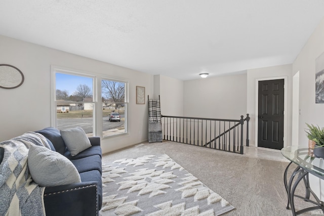 living area with an upstairs landing