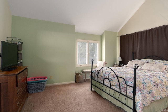 bedroom featuring carpet, lofted ceiling, and baseboards