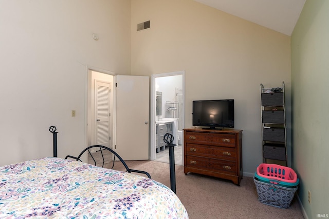 bedroom with visible vents, light carpet, connected bathroom, high vaulted ceiling, and baseboards