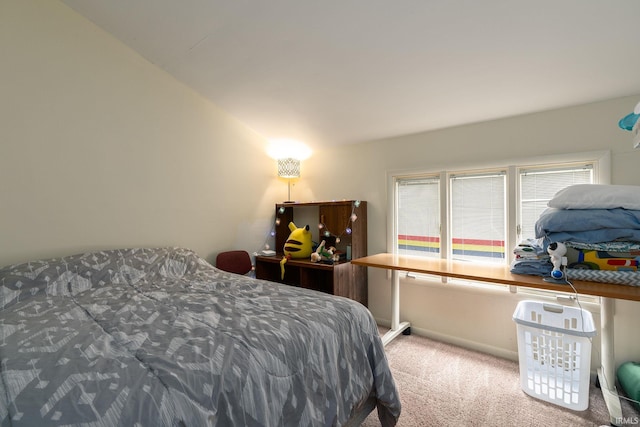 carpeted bedroom featuring baseboards