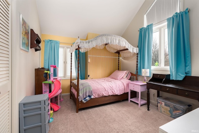 bedroom with vaulted ceiling and carpet