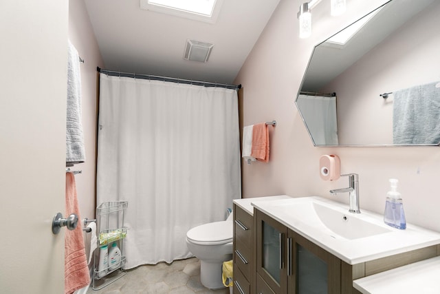 full bathroom featuring visible vents, vanity, and toilet