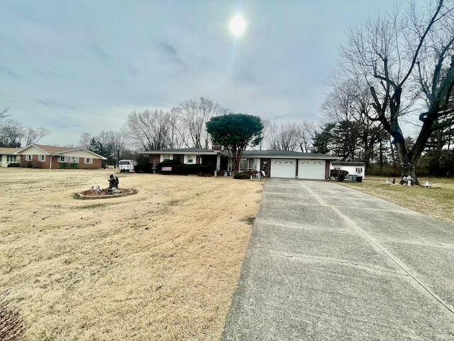 single story home featuring an attached garage and driveway