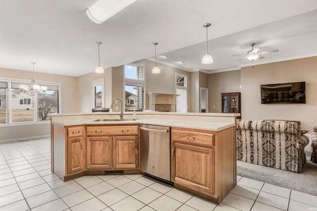 kitchen featuring open floor plan, light countertops, a sink, and stainless steel dishwasher