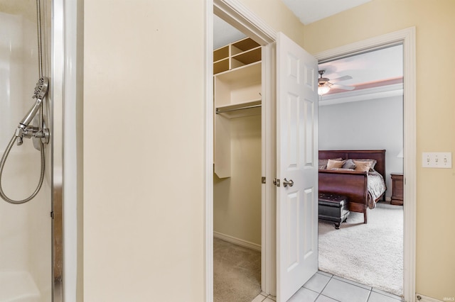 interior space featuring light tile patterned floors and light colored carpet