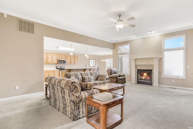 living room featuring ornamental molding, visible vents, and light colored carpet