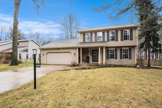 colonial inspired home featuring concrete driveway, covered porch, fence, a garage, and a front lawn