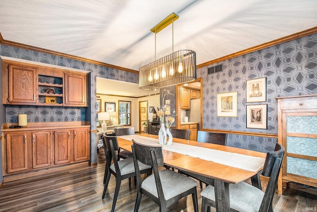 dining space featuring dark wood-style flooring, visible vents, crown molding, and wallpapered walls