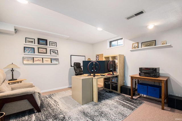 home office featuring carpet, visible vents, and baseboards