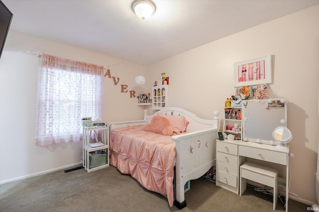 carpeted bedroom with baseboards