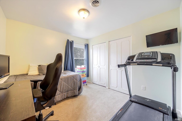 office space with visible vents and carpet flooring