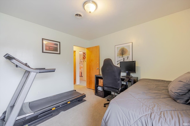 bedroom with visible vents and carpet flooring