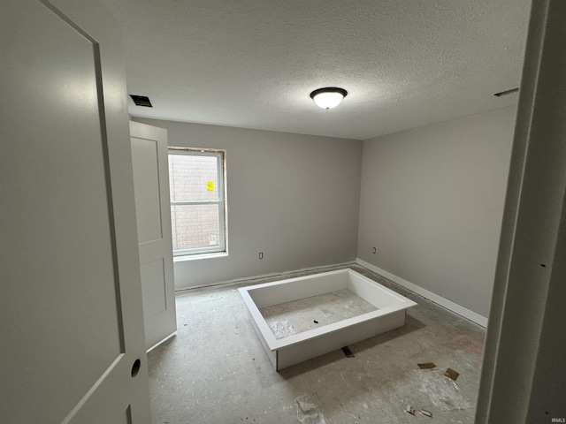 bathroom with a textured ceiling