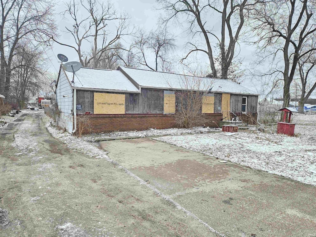 view of front of home featuring brick siding