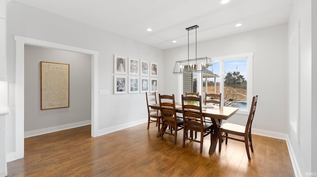 dining area featuring a chandelier, recessed lighting, wood finished floors, and baseboards