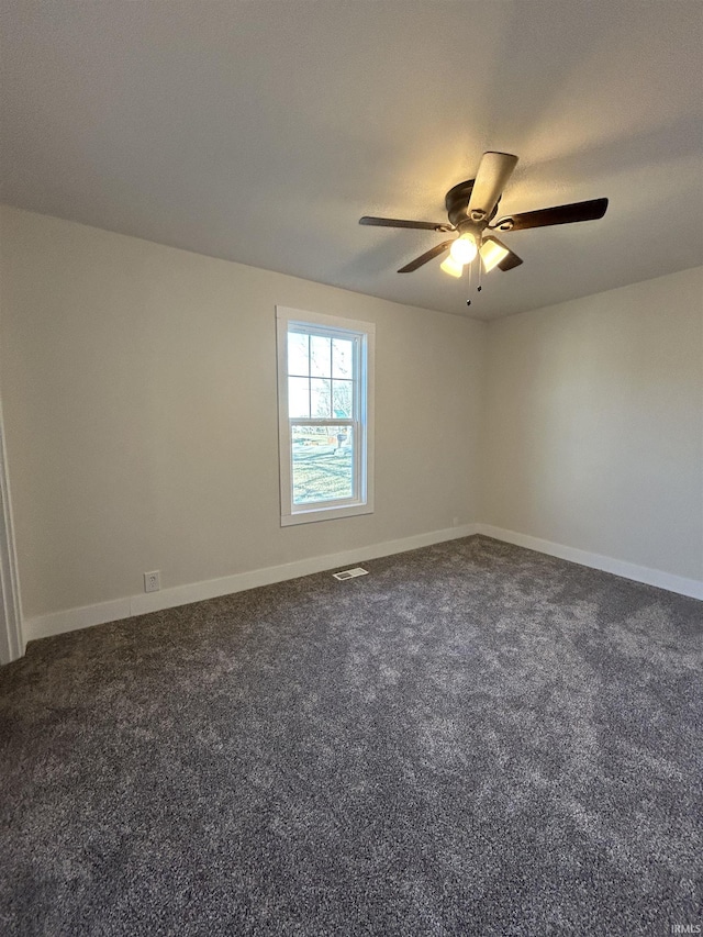 unfurnished room featuring carpet floors, visible vents, ceiling fan, and baseboards