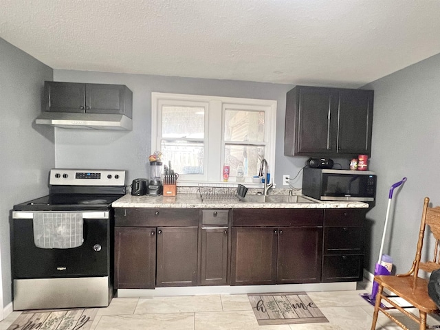 kitchen with a textured ceiling, extractor fan, a sink, dark brown cabinets, and appliances with stainless steel finishes