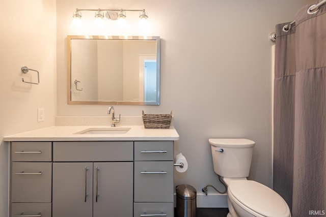 full bathroom with vanity and toilet