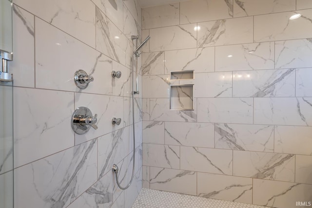 full bathroom with tiled shower