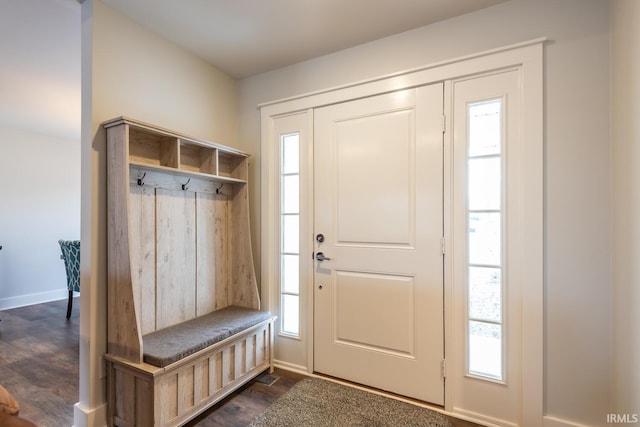 mudroom with baseboards and dark wood finished floors