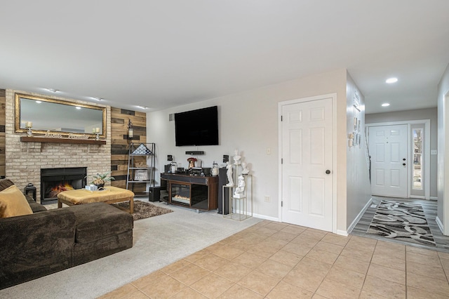 carpeted living room featuring baseboards, recessed lighting, a brick fireplace, and tile patterned floors