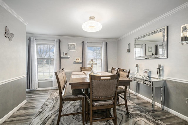 dining area featuring crown molding, dark wood-type flooring, and a wealth of natural light