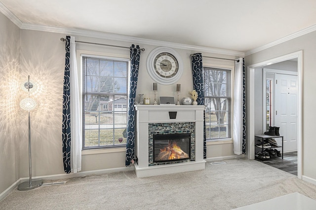 carpeted living room featuring ornamental molding, a fireplace, and baseboards