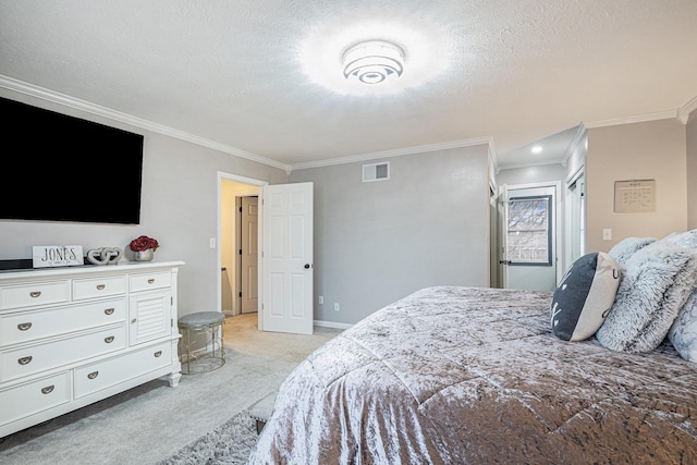 bedroom with a textured ceiling, light colored carpet, visible vents, baseboards, and crown molding