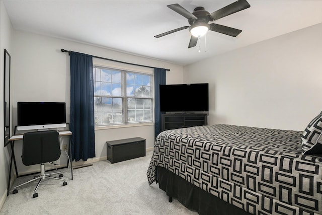 carpeted bedroom featuring a ceiling fan and baseboards