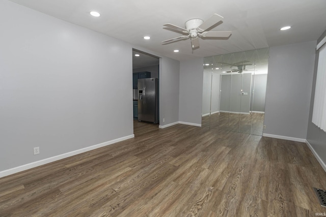 unfurnished room with a ceiling fan, recessed lighting, baseboards, and wood finished floors