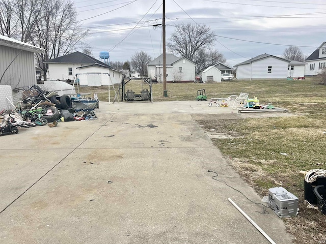 view of road featuring concrete driveway