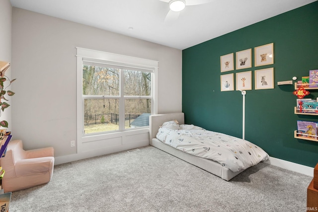 bedroom with carpet floors, ceiling fan, and baseboards