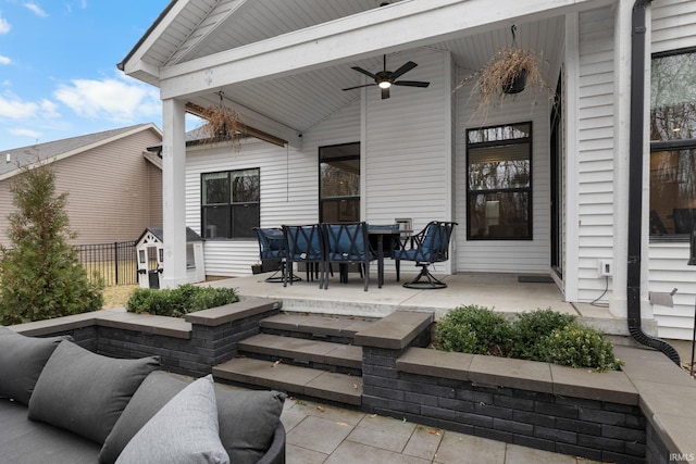 view of patio with fence and a ceiling fan