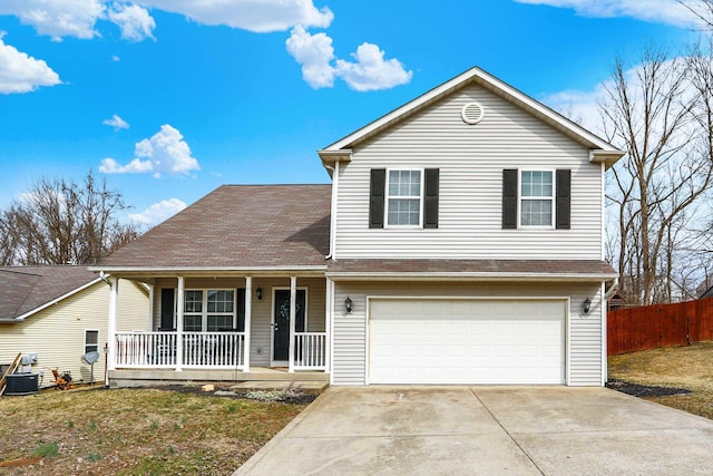 traditional-style home with driveway, a garage, covered porch, fence, and a front yard