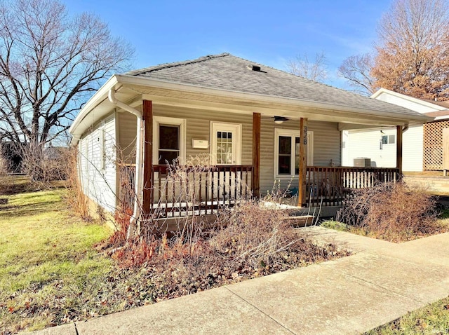 view of front facade with a porch and roof with shingles