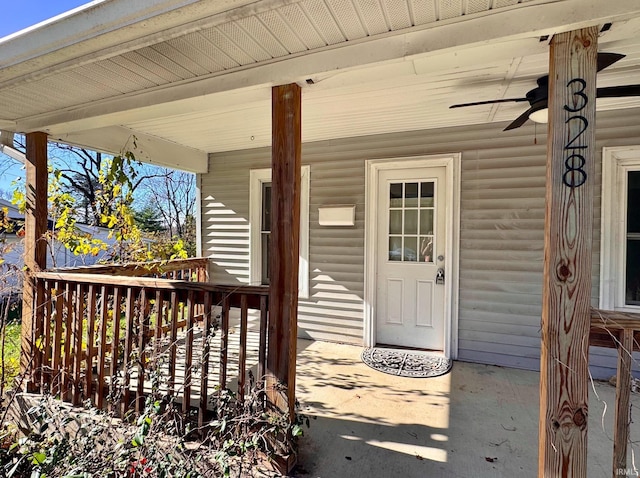 view of exterior entry featuring covered porch