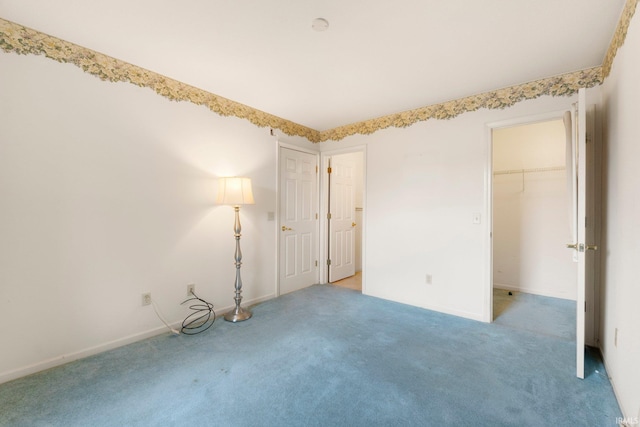 empty room with light colored carpet