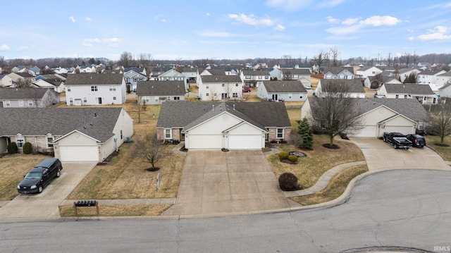 birds eye view of property with a residential view