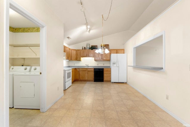 kitchen featuring light countertops, vaulted ceiling, a sink, white appliances, and independent washer and dryer