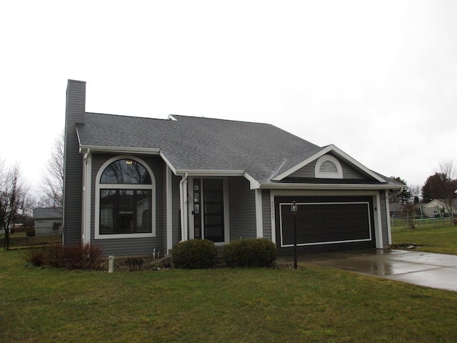 ranch-style home with roof with shingles, a chimney, concrete driveway, a front yard, and a garage