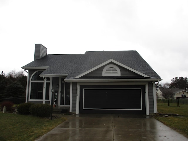 ranch-style house featuring driveway, a chimney, roof with shingles, an attached garage, and a front lawn