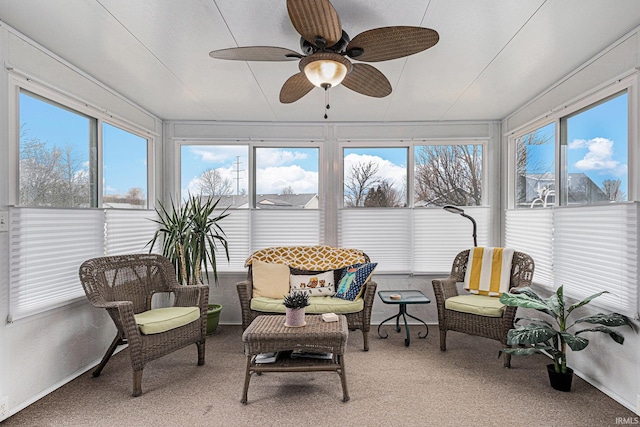 sunroom / solarium featuring a ceiling fan